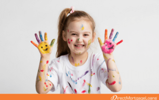 Kid with paint on hands and face